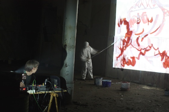 crazy iluminated wall with performance artist